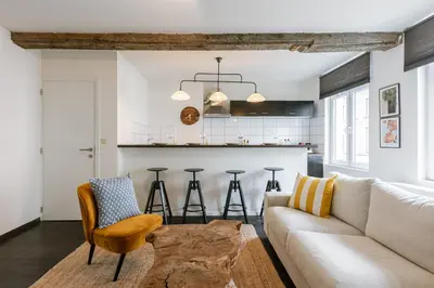 a living room with a couch and a table at Right In The City Center Your Ghent Getaway in Ghent