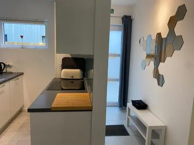 a kitchen with a counter with a toaster on it at Bella Vie, rust en ontspanning in Haacht
