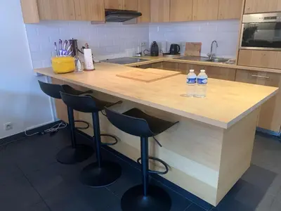 a kitchen with two bottles of water sitting on a counter at Casa Alness in Wetteren