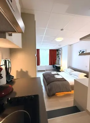a bedroom with a bed in a room at Heart of Grand Place Beautiful Studio in Brussels