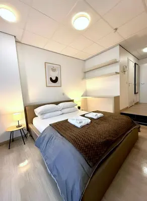 a bedroom with a large bed in a room at Heart of Grand Place Beautiful Studio in Brussels