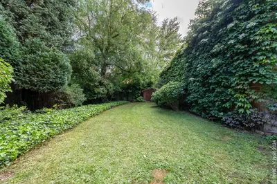 a path through a garden with trees and grass at La Louve - Big Place & Garden - Parking Gratuit in Brussels