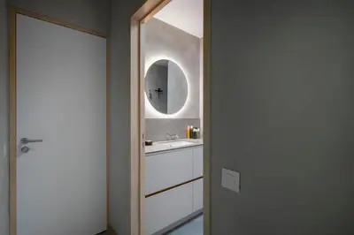 a bathroom with a sink and a mirror at Nuit Blanche in Oud-Heverlee