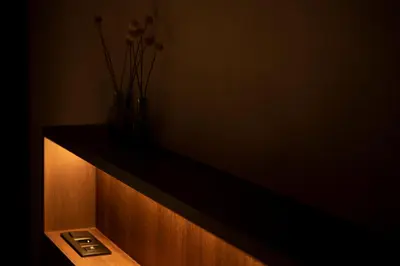 a shelf with two vases and flowers on it at Nuit Blanche in Oud-Heverlee