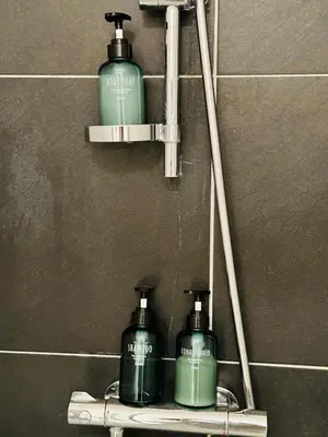 two bottles of soap on a shelf in a bathroom at Urbanstay Suites - Grand Place 2 Bd Penthouse in Brussels