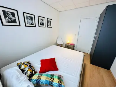 a white couch with pillows on it in a room at Urbanstay Suites - Grand Place 2 Bd Penthouse in Brussels