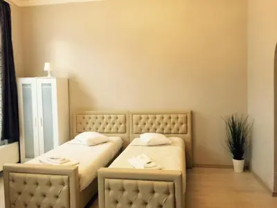 two twin beds in a room with at Prestige Flats in Brussels