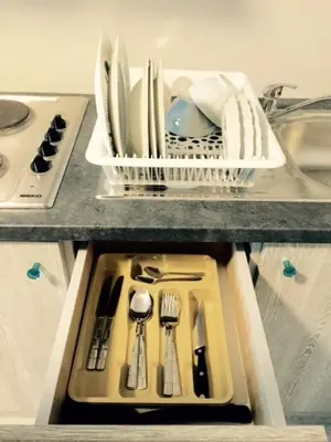 a drawer filled with utensils on a kitchen counter at Prestige Flats in Brussels