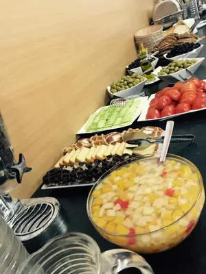 a table topped with lots of different types of food at Prestige Flats in Brussels