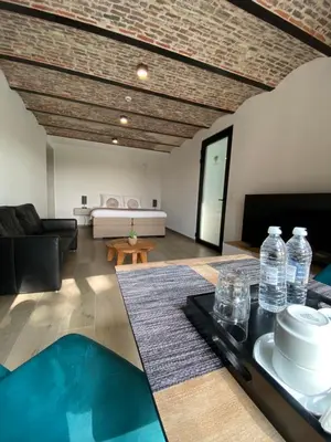a living room with a table with water bottles on it at HVN10 - Near Antwerp in Stabroek