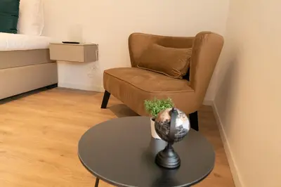 a room with a chair and a table and a chair at HVN10 - Near Antwerp in Stabroek