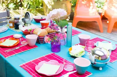 a blue table with food and plates on it at Guest House Les 3 Tilleuls in Brussels