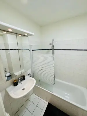 a bathroom with a sink and a shower and a tub at Urbanstay Suites Apartment In Charming Sablon in Brussels