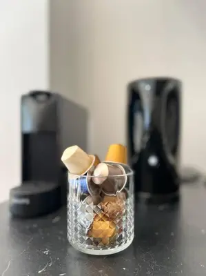 a glass container filled with food on top of a counter at Amazing flat-Center of Brussels in Brussels
