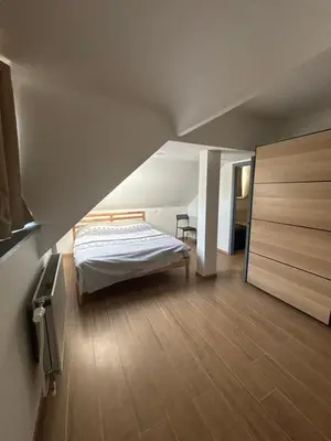 a bedroom with a bed in a attic at Elegance & Comfort Brand New Apartment near to Atomium in Brussels