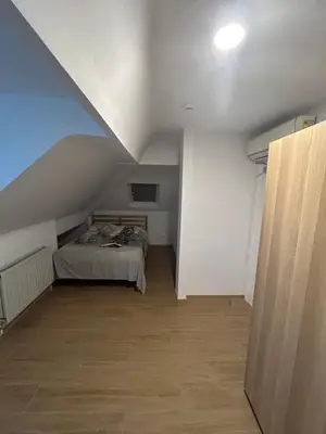 a bedroom with a bed in a attic at Elegance & Comfort Brand New Apartment near to Atomium in Brussels