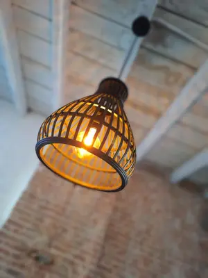 a light hanging from a ceiling in a room at Huis ALNA 4 in Mechelen