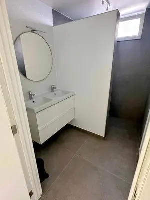a bathroom with a sink and a mirror at Akuta City Flat Leuven in Leuven