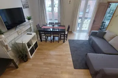 a living room with a couch and a table at Charming 1-Bedroom Apartment in Brussels