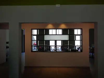 a living room with a large window in a room at Brxxl 5 City Centre Hostel in Brussels