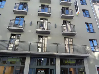 a building with balconies on the side of it at Brxxl 5 City Centre Hostel in Brussels