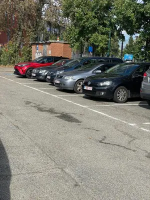 a row of parked cars in a parking lot at Chez Auguy et Deborah in Antwerp