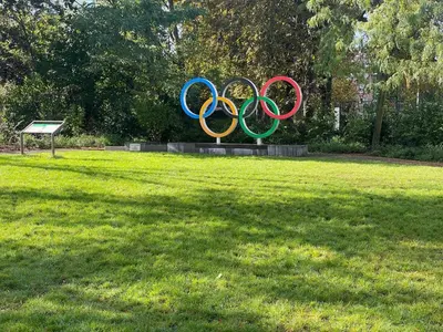 a statue of the olympic rings in a park at Chez Auguy et Deborah in Antwerp