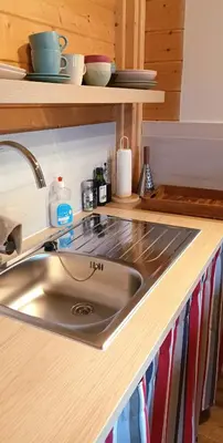 a kitchen with a sink and a counter top at Wood-and-work in Wavre