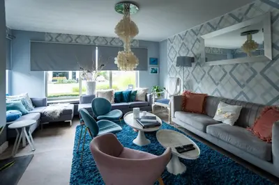 a living room with a couch and chairs and a table at Vakantievilla met zwembad, wellness en glamping in Paal/Beringen in Beringen