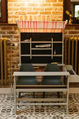 a room with two chairs and a table and radiator at Parkhoeve Vakantiewoning voor 21 personen in Ham
