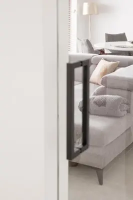 a living room with two couches with pillows at Brand New Apartment Sint-niklaas in Sint-Niklaas