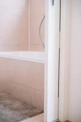 a bathroom with a bath tub and a shower stall at Appartement vlakbij Antwerpen centrum! in Antwerp