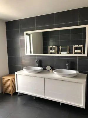 a bathroom with two sinks and a mirror at Central Oasis near Brussels / Airport in Kortenberg