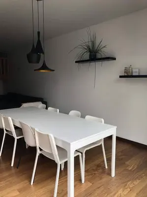 a white dining room table with white chairs at Central Oasis near Brussels / Airport in Kortenberg