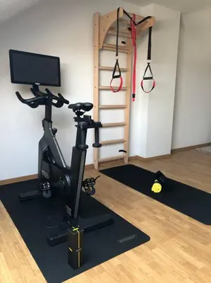 a room with a gym with a treadmill and a tv at Central Oasis near Brussels / Airport in Kortenberg