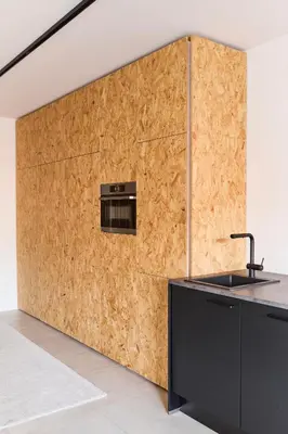 a kitchen with a wall covered in wood at The Banker Antwerpen - Free Parking in Antwerp