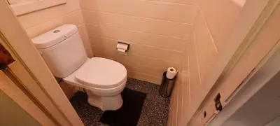 a bathroom with a white toilet in a room at COSY APPARTMENT 3 BEDSROOM in Antwerp