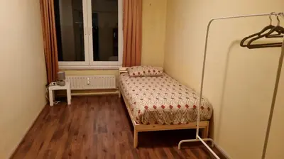 a small room with a bed and a window at COSY APPARTMENT 3 BEDSROOM in Antwerp