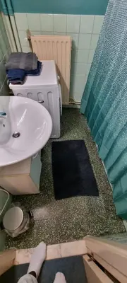 a bathroom with a sink and a shower curtain at COSY APPARTMENT 3 BEDSROOM in Antwerp