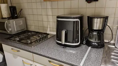 a kitchen counter with a coffee maker and a blender at COSY APPARTMENT 3 BEDSROOM in Antwerp
