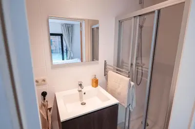 a bathroom with a sink and a shower at K&Y suites 3 Brussels airport 500m! in Zaventem