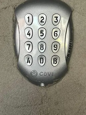 a close up of a remote control with numbers on it at K&Y suites 3 Brussels airport 500m! in Zaventem