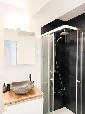 a bathroom with a sink and a shower at Cosy Appartement Nammos 1 - 4 p in Antwerp