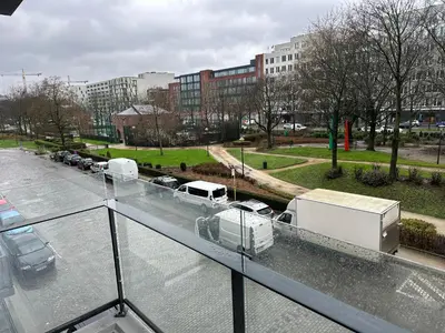 a view of a parking lot with vehicles on a roof at Furnished 2 Bedroom Apartment in City Center in Brussels