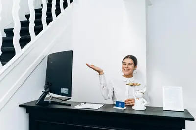 a woman standing in front of a desk with a computer at Atomihotel: Contemporary Comfort Steps from the Atomium! in Brussels