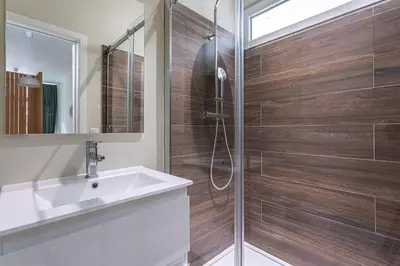 a bathroom with a shower with a sink and a mirror at Studio2 Van Lerius in Antwerp