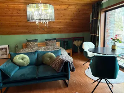 a living room with a couch and a table at Efes home in Ghent