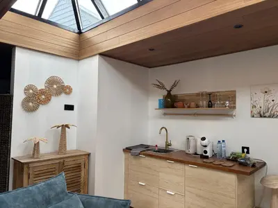 a room with a kitchen with a skylight at Efes home in Ghent