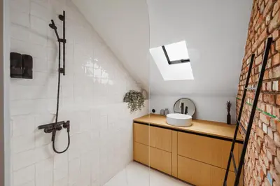a bathroom with a sink and a shower at The barn - Waasmunster in Waasmunster
