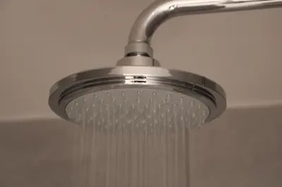 a shower head with water dripping from it at Antwerp White House in Antwerp